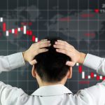 55617805 - an investor is looking at screen showing stock market crash